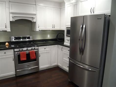 granite countertops white cabinets black stainless steel appliances|black appliances and countertops.